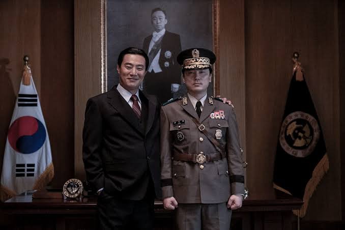 The Man Standing Next